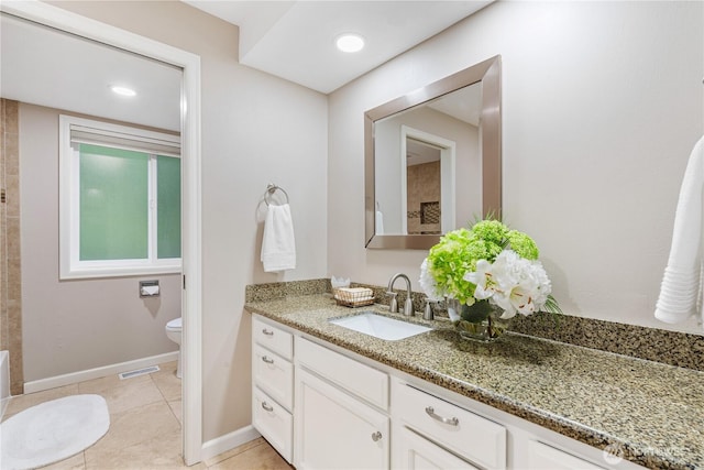 21016 NE 33rd Pl, Sammamish, WA 98074 - full bath with toilet, vanity, tile patterned flooring, and baseboards
