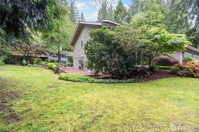 21016 NE 33rd Pl, Sammamish, WA 98074 - rear view of house with a lawn