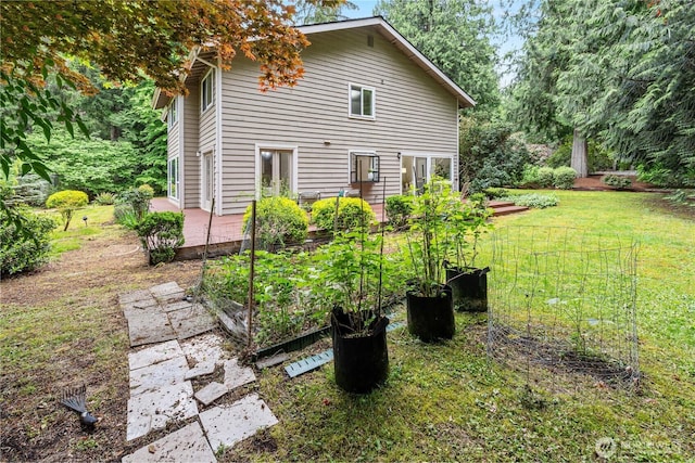 21016 NE 33rd Pl, Sammamish, WA 98074 - view of home's exterior featuring a garden and a yard