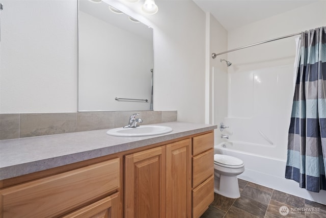 15325 NE 106th St, Vancouver, WA 98682 - bathroom with vanity, toilet, shower / tub combo with curtain, and stone finish flooring