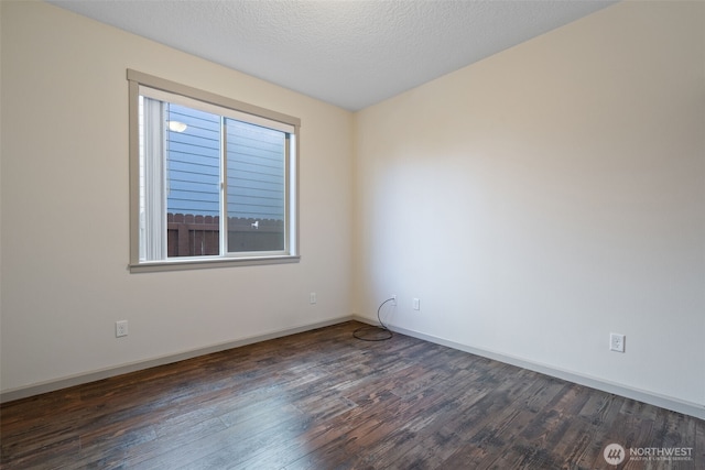 15325 NE 106th St, Vancouver, WA 98682 - spare room featuring dark wood-style floors, baseboards, and a textured ceiling