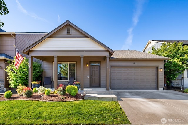15325 NE 106th St, Vancouver, WA 98682 - view of front of home featuring covered porch, a garage, concrete driveway, and a front lawn