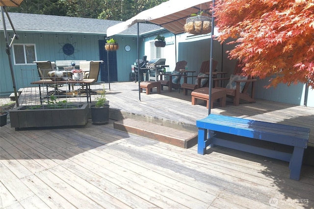 deck with outdoor dining area