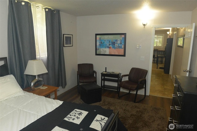 bedroom featuring dark wood-type flooring