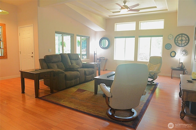 332 Rhododendron Dr, Sequim, WA 98382 - living room with a ceiling fan, light wood finished floors, a high ceiling, baseboards, and a raised ceiling