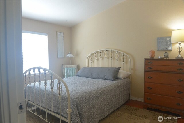 332 Rhododendron Dr, Sequim, WA 98382 - bedroom with baseboards and wood finished floors