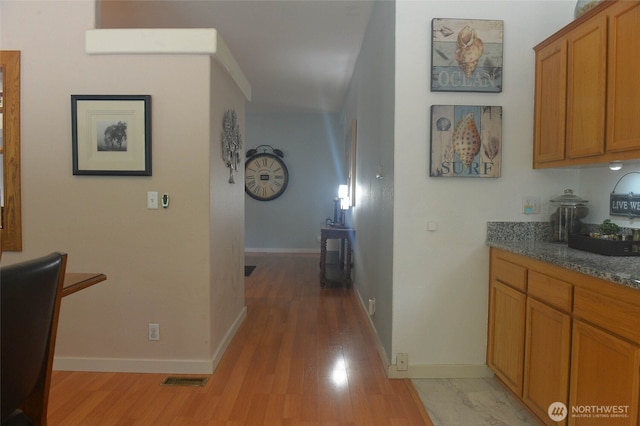332 Rhododendron Dr, Sequim, WA 98382 - corridor with a wall mounted AC, light wood-style flooring, and baseboards