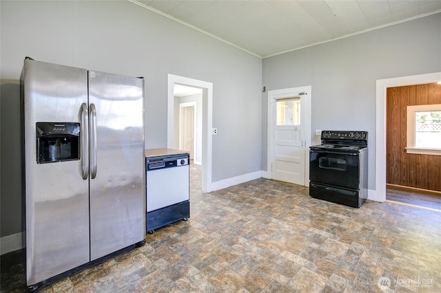 kitchen featuring stainless steel fridge, black electric range, dishwasher, stone finish flooring, and crown molding