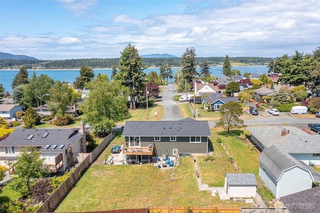 aerial perspective of suburban area with a water and mountain view