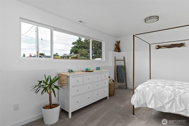 bedroom with carpet and baseboards