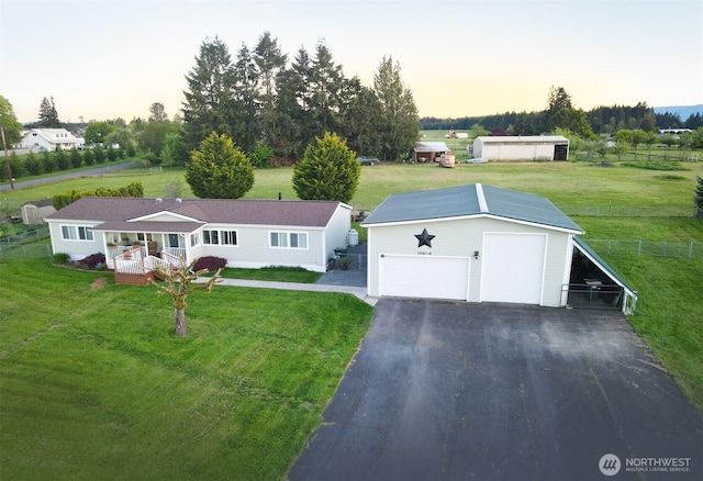 view of front of house featuring an outbuilding and a detached garage