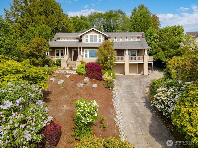 1533 S Sunset Dr, Tacoma, WA 98465 - view of front of house with asphalt driveway, a porch, and an attached garage