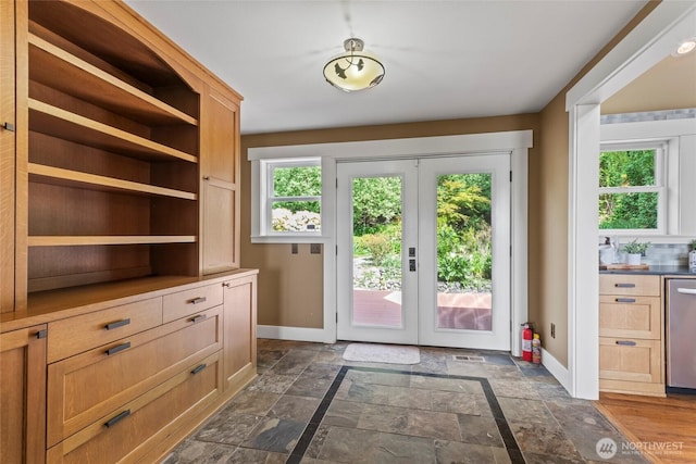1533 S Sunset Dr, Tacoma, WA 98465 - entryway with baseboards, french doors, and stone tile flooring