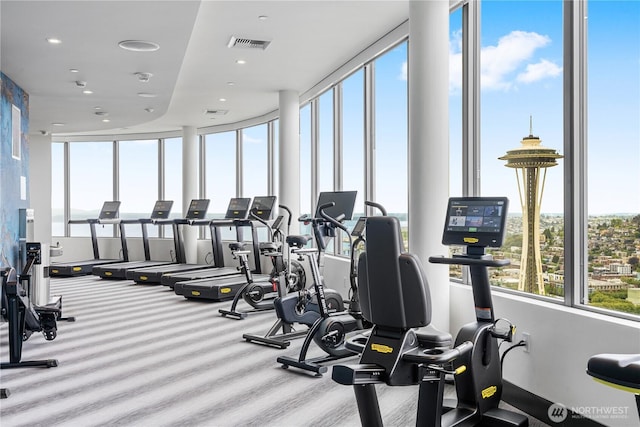 exercise room with carpet flooring and recessed lighting