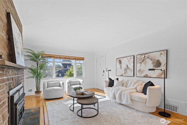 3112 13th Ave S, Seattle, WA 98144 - living area with a brick fireplace and wood finished floors