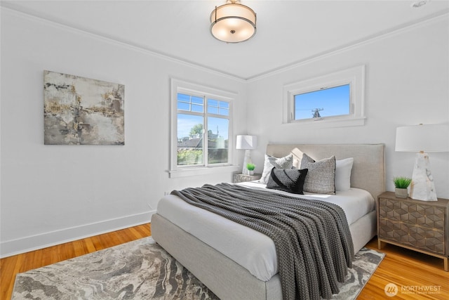 3112 13th Ave S, Seattle, WA 98144 - bedroom featuring crown molding, wood finished floors, and baseboards