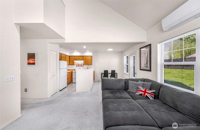 living room featuring a wall mounted air conditioner, light colored carpet, baseboards, high vaulted ceiling, and recessed lighting