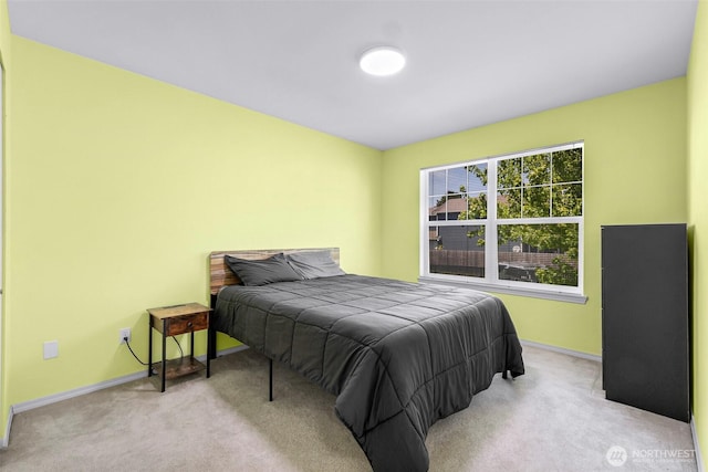bedroom with carpet and baseboards