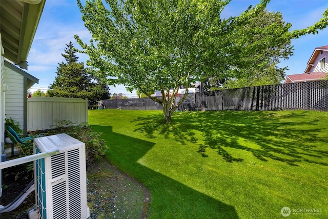 view of yard featuring central AC unit