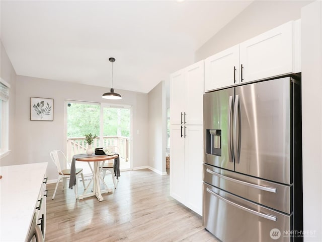 6723 50th Pl NE, Marysville, WA 98270 - kitchen featuring stainless steel fridge, light wood finished floors, white cabinetry, light countertops, and baseboards