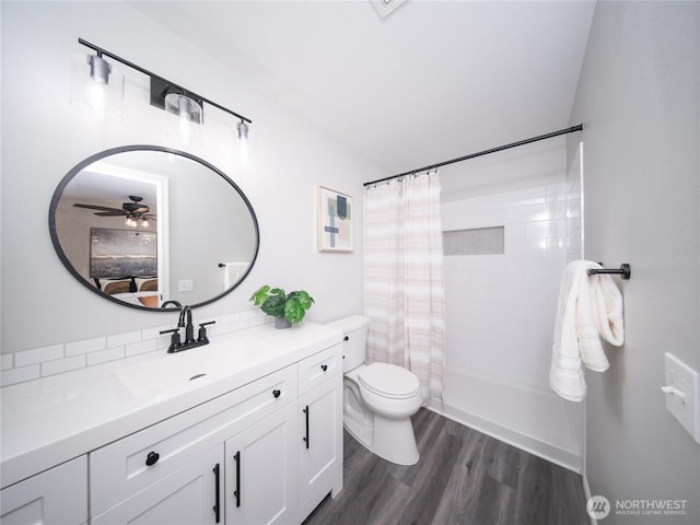 6723 50th Pl NE, Marysville, WA 98270 - ensuite bathroom featuring toilet, a shower with shower curtain, wood finished floors, vanity, and a ceiling fan