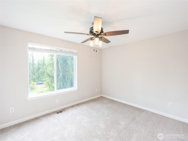 6723 50th Pl NE, Marysville, WA 98270 - carpeted spare room with baseboards and a ceiling fan