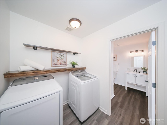 6723 50th Pl NE, Marysville, WA 98270 - clothes washing area with washer and clothes dryer, dark wood finished floors, and baseboards