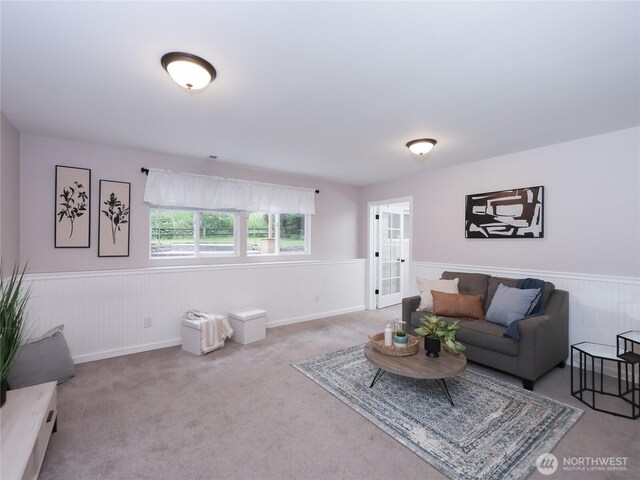 6723 50th Pl NE, Marysville, WA 98270 - living room featuring wainscoting, french doors, and carpet floors
