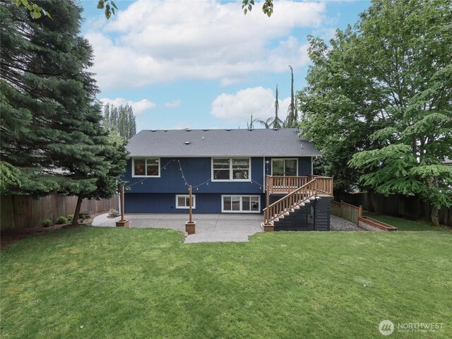 6723 50th Pl NE, Marysville, WA 98270 - rear view of property featuring a patio area, stairway, a shingled roof, and a deck
