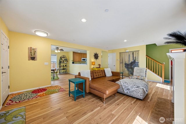 2758 Mcneil St, Dupont, WA 98327 - living room featuring light wood-style floors, baseboards, stairway, a ceiling fan, and recessed lighting