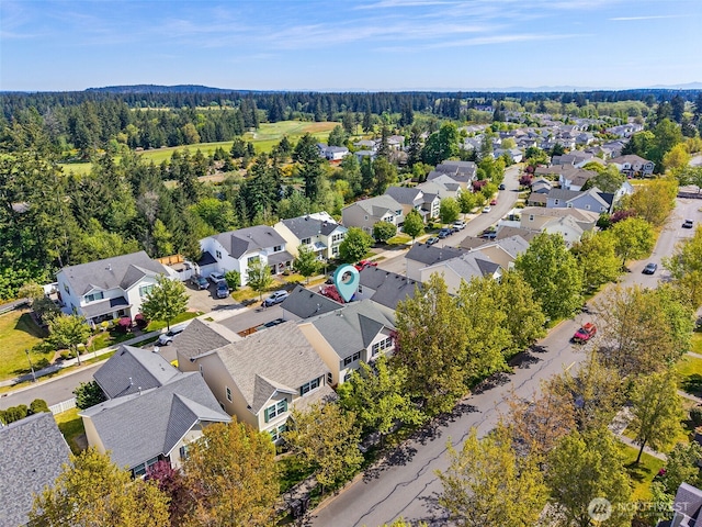 2758 Mcneil St, Dupont, WA 98327 - aerial perspective of suburban area featuring a heavily wooded area