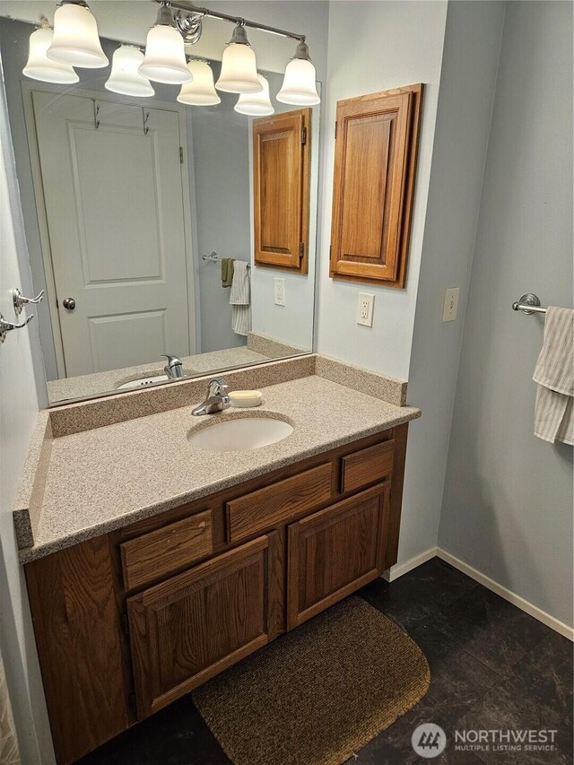bathroom featuring vanity and baseboards