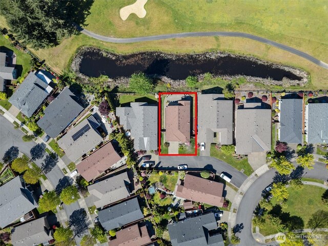 aerial overview of property's location with property boundaries highlighted and nearby suburban area