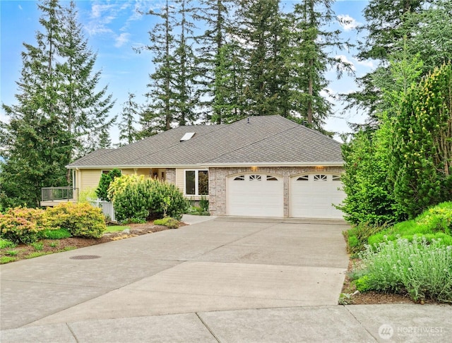 ranch-style home with a garage and driveway