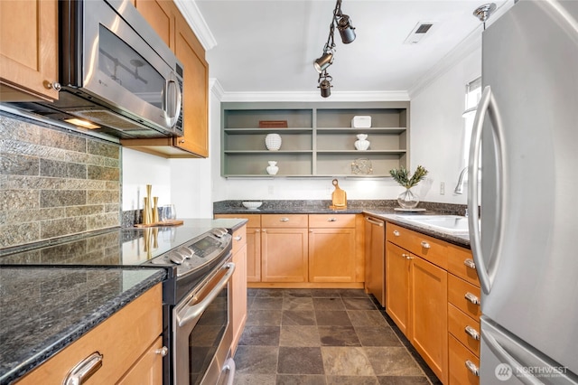 kitchen with appliances with stainless steel finishes, open shelves, a sink, dark stone counters, and tasteful backsplash