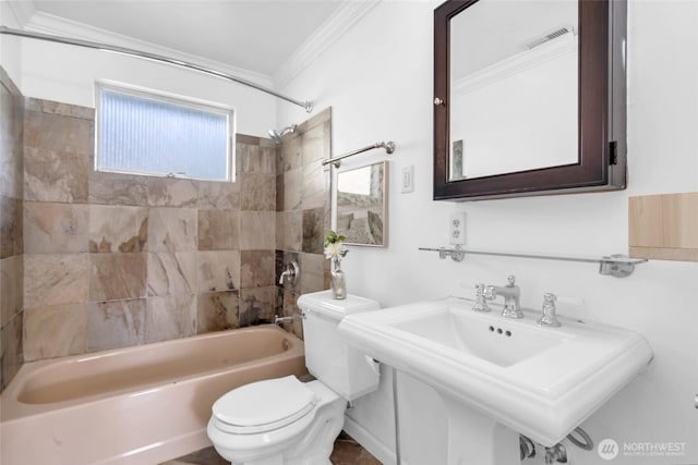 full bathroom with ornamental molding, toilet,  shower combination, and a sink