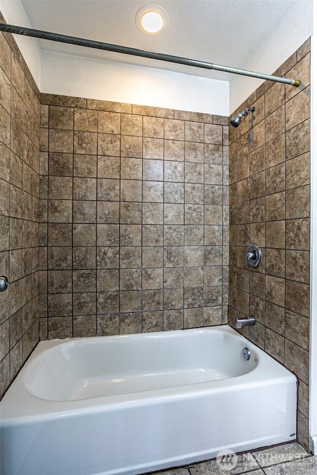 bathroom with washtub / shower combination