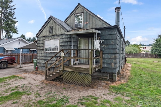 back of property featuring cooling unit and board and batten siding