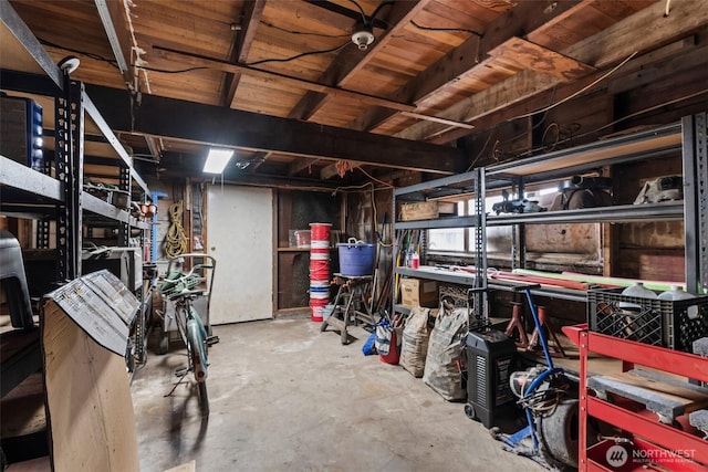unfinished below grade area with a workshop area