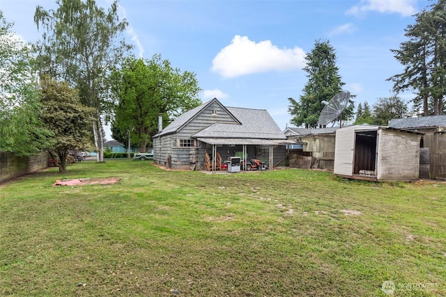 view of yard with a storage shed and an outdoor structure