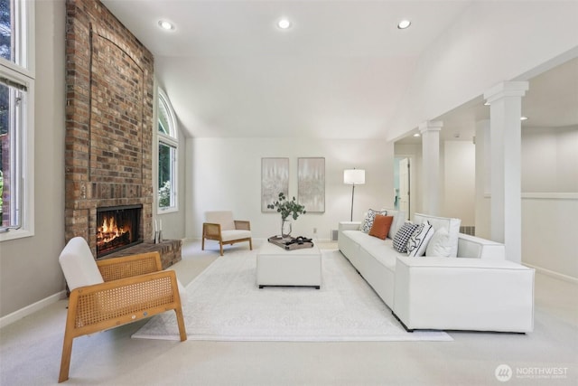 6222 139th Pl SE, Bellevue, WA 98006 - carpeted living area featuring decorative columns, a brick fireplace, vaulted ceiling, recessed lighting, and baseboards
