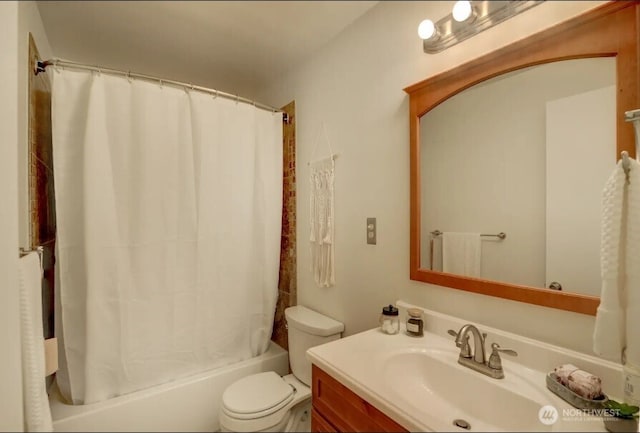 full bathroom featuring vanity, toilet, and shower / bath combination with curtain