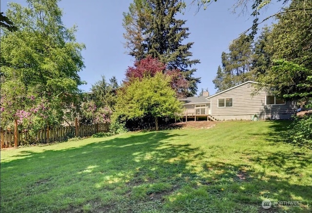 view of yard with a wooden deck