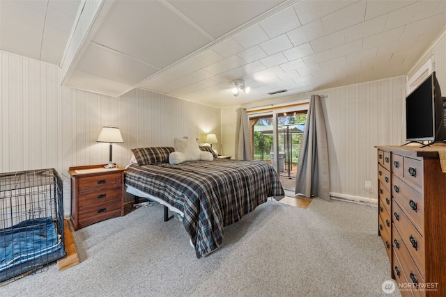 carpeted bedroom featuring access to outside
