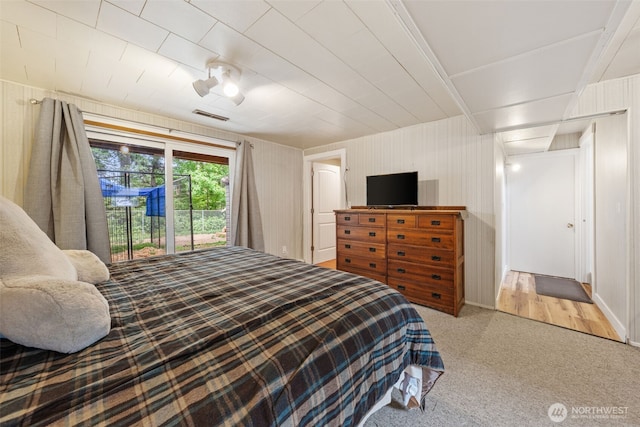 bedroom featuring carpet and access to exterior