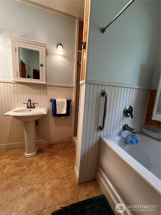 1133 Parkridge Dr, Port Townsend, WA 98368 - bathroom featuring wainscoting, a tub, and tile patterned flooring