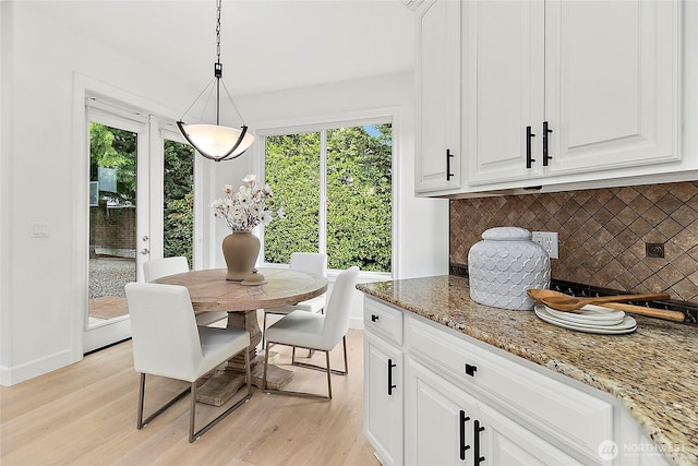 1038 Belfair Rd, Bellevue, WA 98004 - dining space featuring light wood-style floors and baseboards