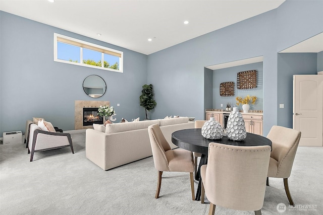 1038 Belfair Rd, Bellevue, WA 98004 - dining area featuring light carpet, a fireplace, recessed lighting, and a baseboard heating unit
