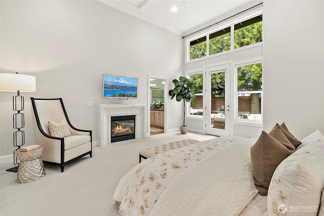 1038 Belfair Rd, Bellevue, WA 98004 - carpeted bedroom with a towering ceiling, a glass covered fireplace, baseboards, access to outside, and ensuite bathroom