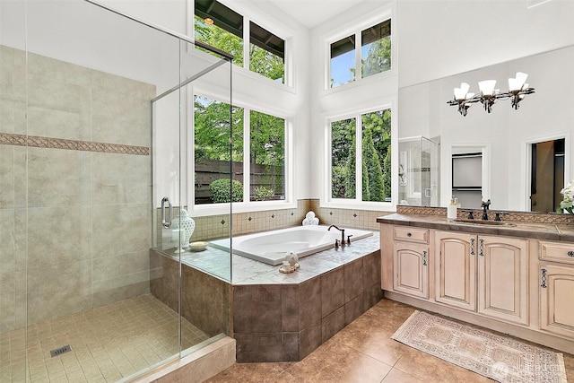 1038 Belfair Rd, Bellevue, WA 98004 - full bathroom with a bath, vanity, a stall shower, tile patterned floors, and a towering ceiling